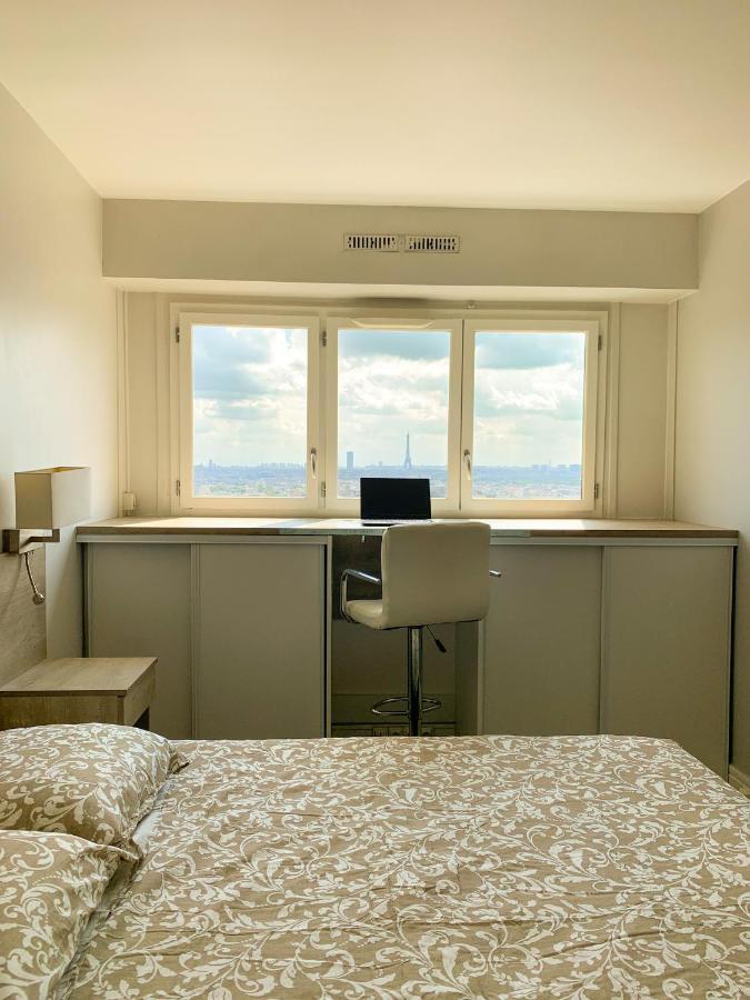 Vue panoramique sur Paris : Sublime appartement au centre de Courbevoie Extérieur photo